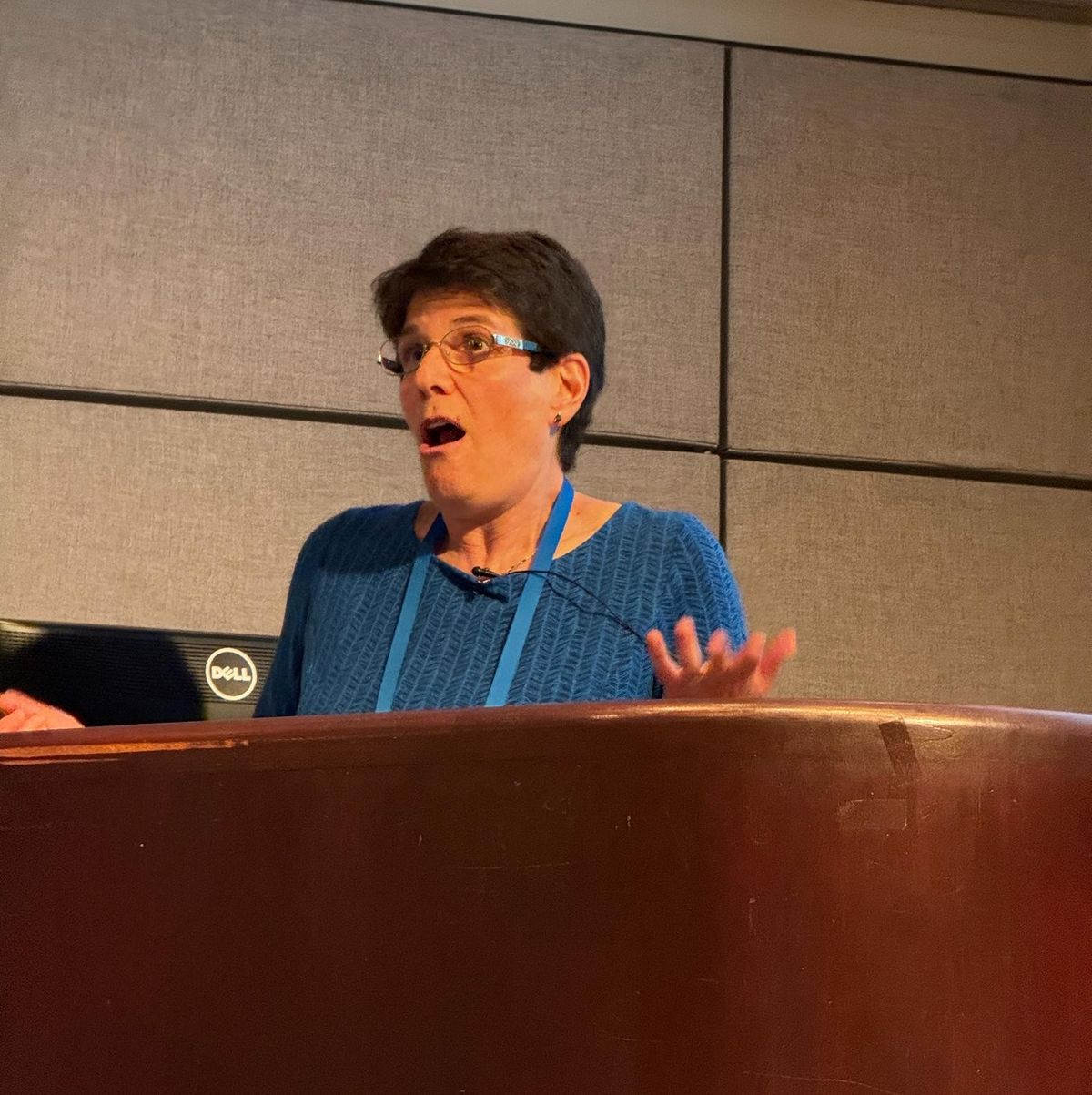 Margo Seltzer speaking and gesturing from the podium during her keynote